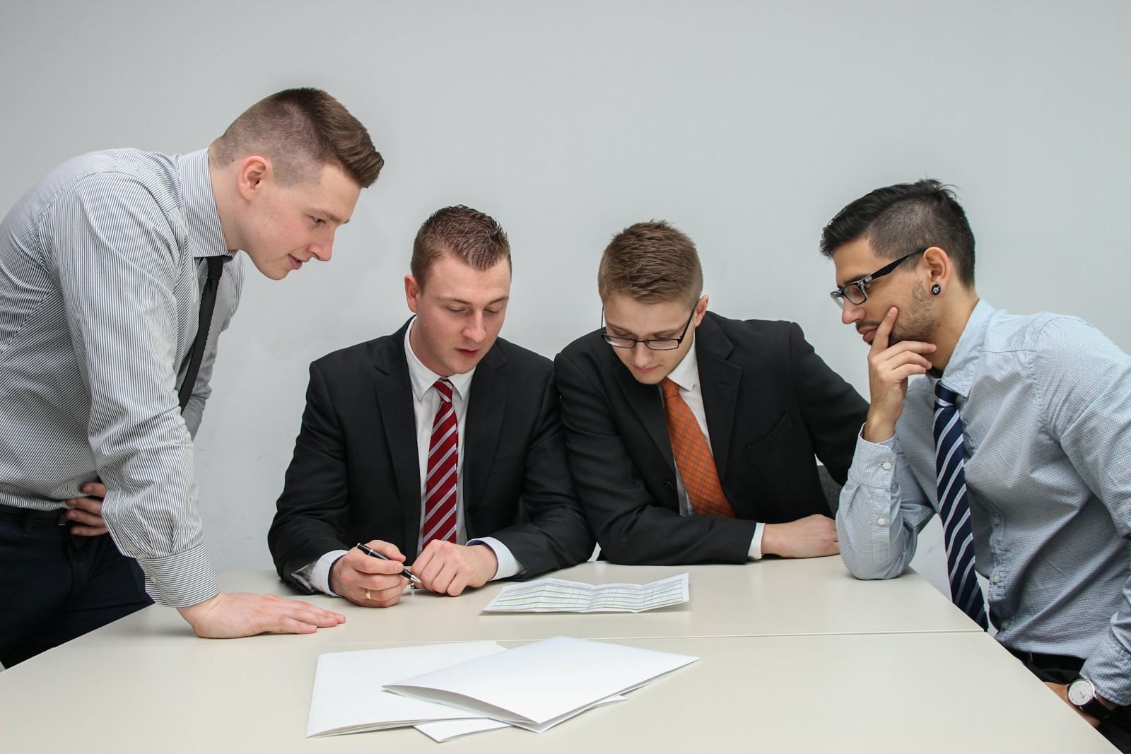 Executives reviewing documents at a table